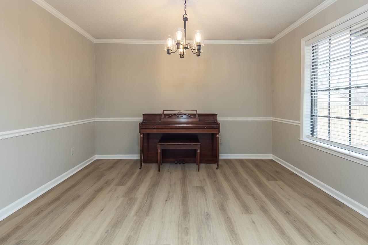 6490 Stone Lake Drive Bartlett, TN 38135 - Photo 14 of 32 a room with a piano and a window