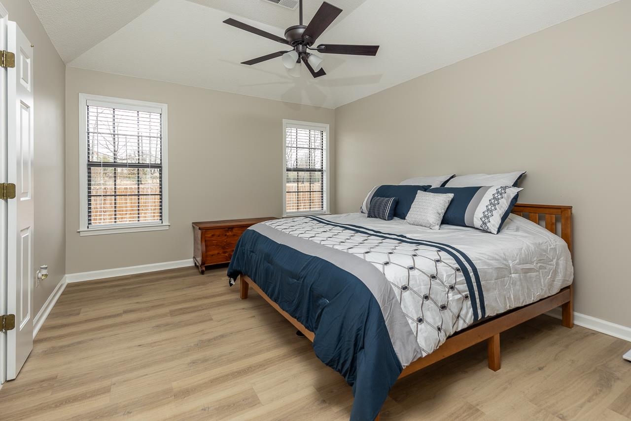 6490 Stone Lake Drive Bartlett, TN 38135 - Photo 16 of 32 a bedroom with a bed and window