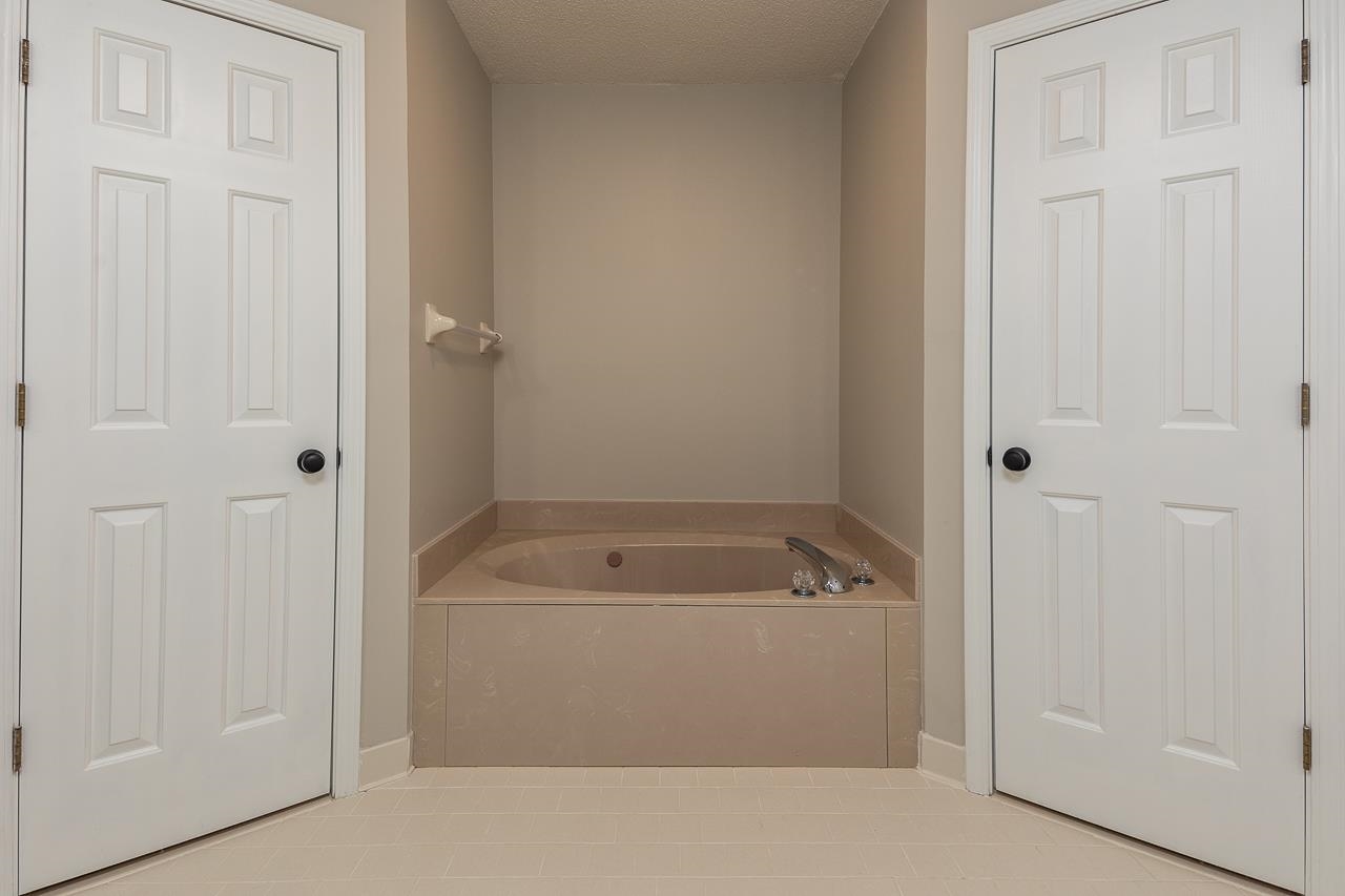 6490 Stone Lake Drive Bartlett, TN 38135 - Photo 19 of 32 a bathroom with a tub