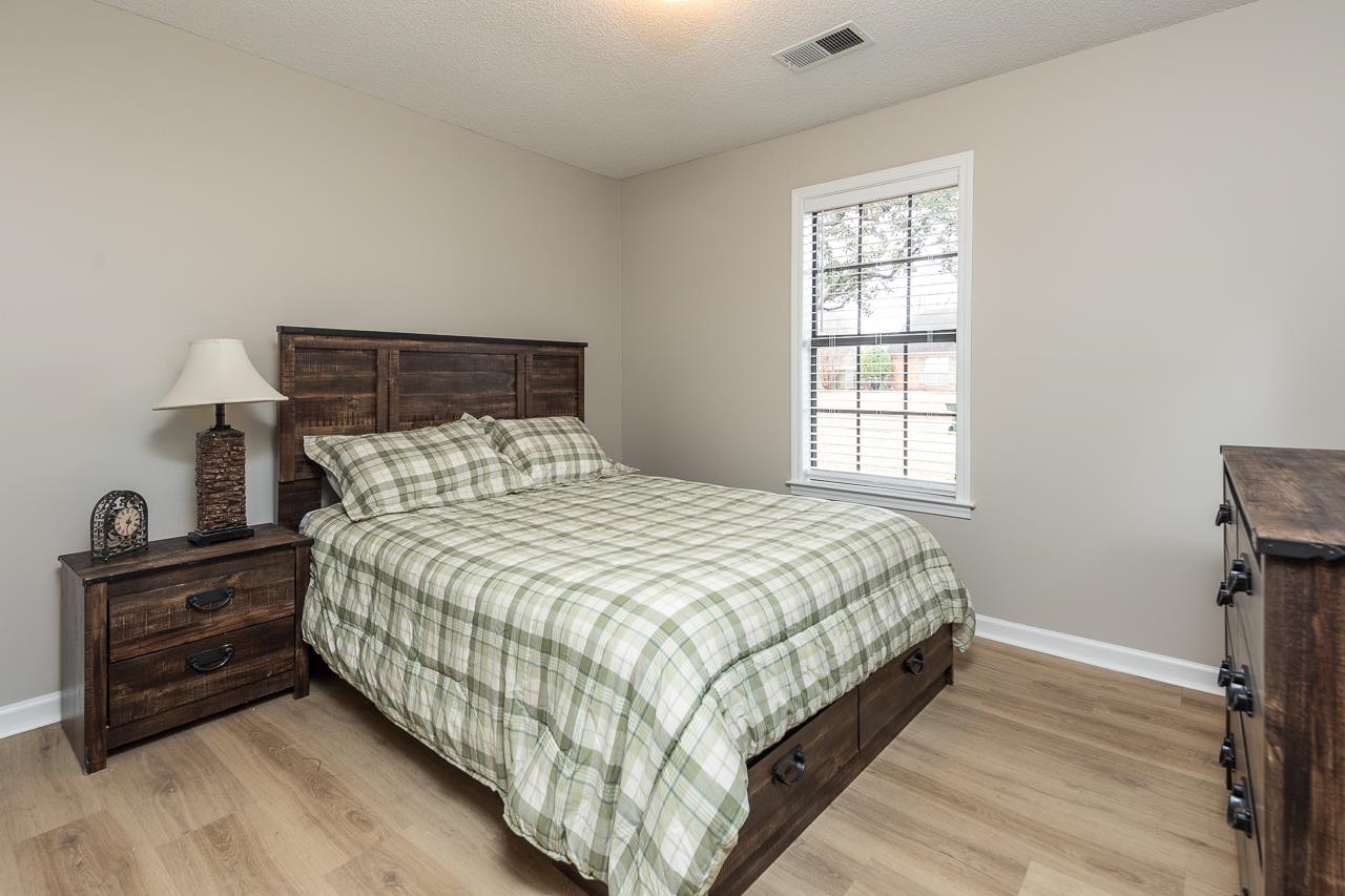 6490 Stone Lake Drive Bartlett, TN 38135 - Photo 21 of 32 a bedroom with a bed and a window