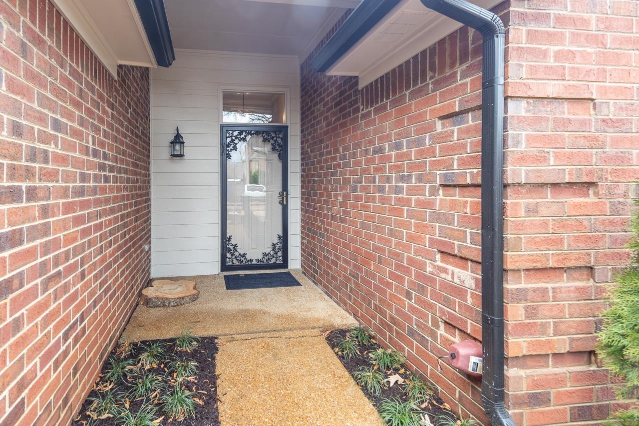 6490 Stone Lake Drive Bartlett, TN 38135 - Photo 5 of 32 a view of a brick house with an outdoor space