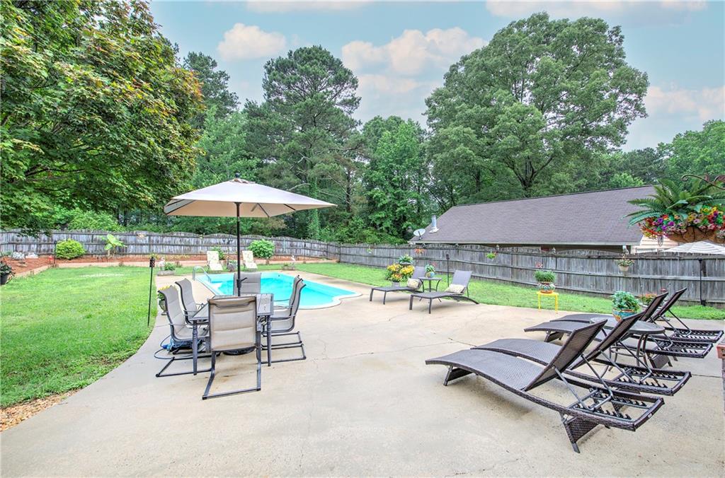 3637 Nebo Road Hiram, GA 30141 - Photo 61 of 63 a view of backyard with swimming pool and outdoor seating