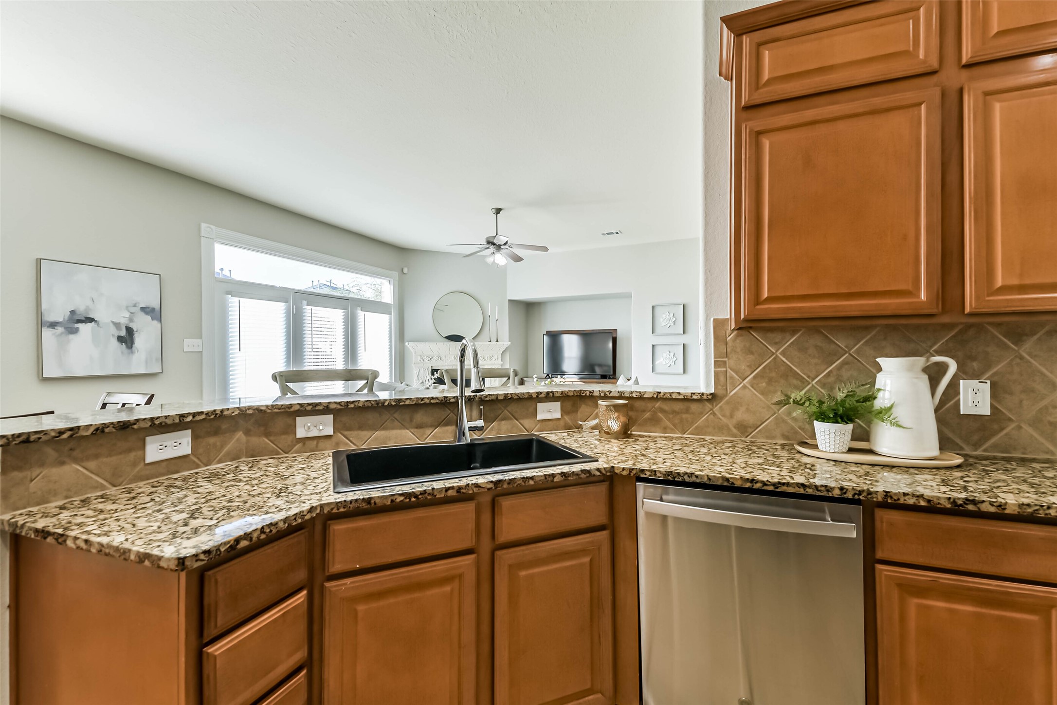 19022 Greenleaf Ridge Court Cypress, TX 77429 - Photo 20 of 47 a kitchen with granite countertop a sink and cabinets