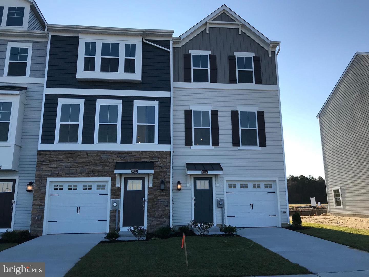36073 Auburn Way Millsboro, DE 19966 - Photo 1 of 22 a front view of a house with a yard