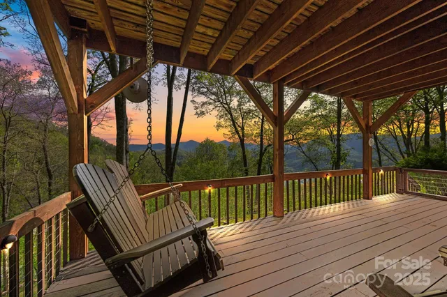 a view of balcony with wooden floor and outdoor seating