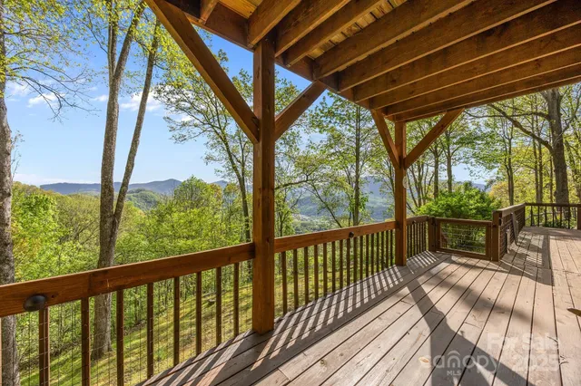 a view of balcony with wooden floor
