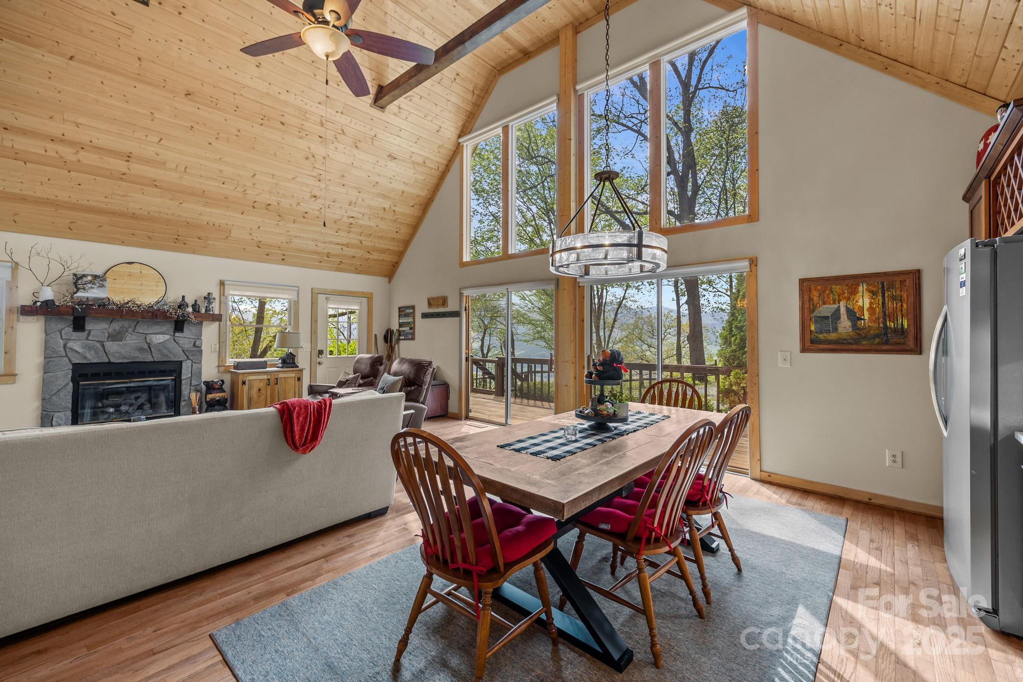 1954 Utah Mountain Road Waynesville, NC 28785 - Photo 17 of 39 a view of a dining room with furniture window and wooden floor