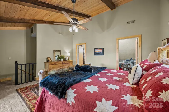 a bed room with a bed and a chandelier