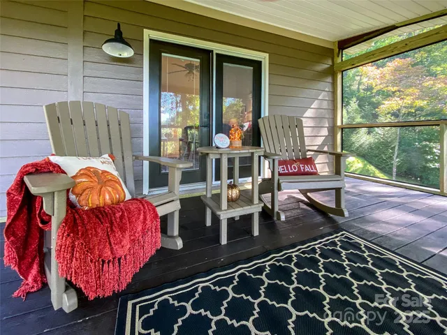 a view of a balcony with furniture