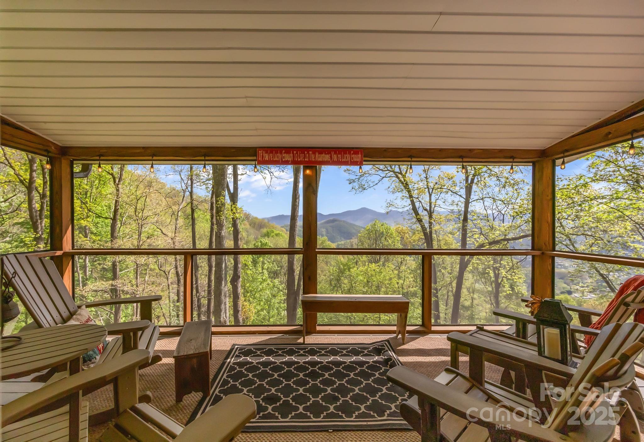 1954 Utah Mountain Road Waynesville, NC 28785 - Photo 35 of 39 a living room with large windows