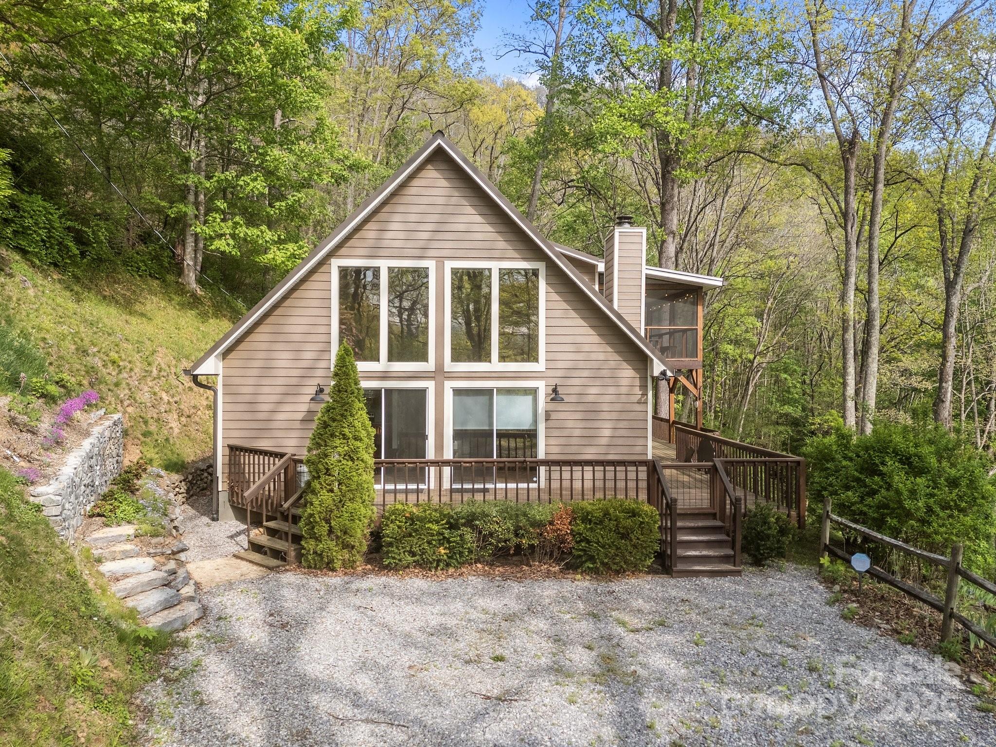 1954 Utah Mountain Road Waynesville, NC 28785 - Photo 6 of 39 a front view of a house with a yard