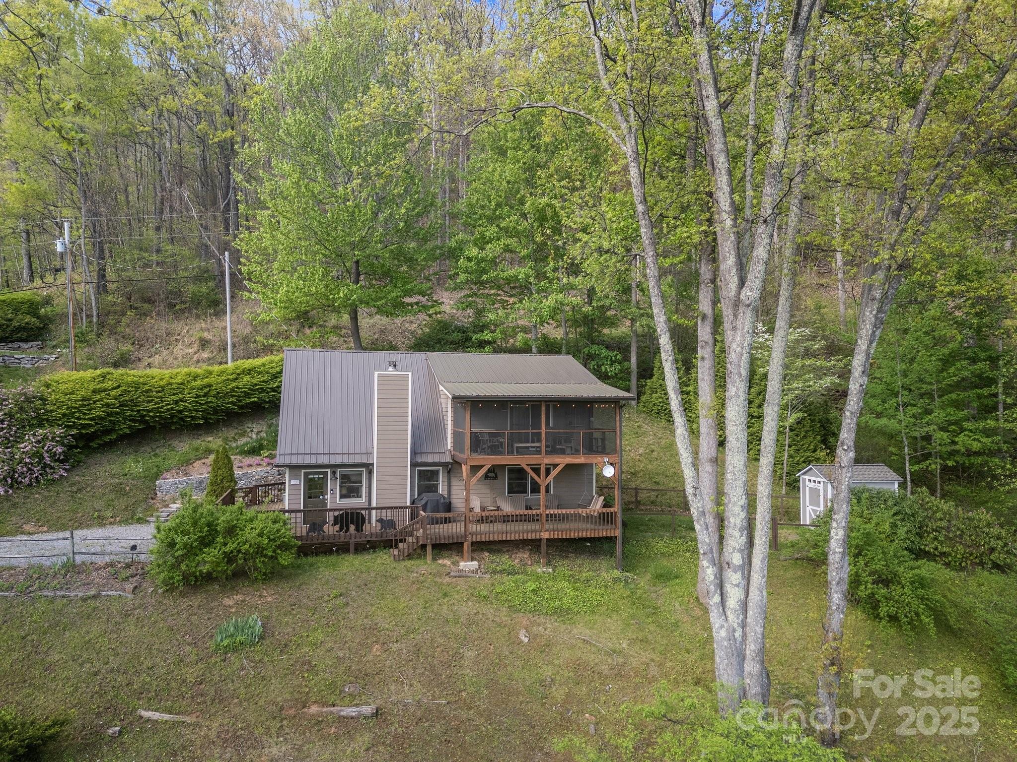 1954 Utah Mountain Road Waynesville, NC 28785 - Photo 7 of 39 a view of a house with backyard garden and sitting area
