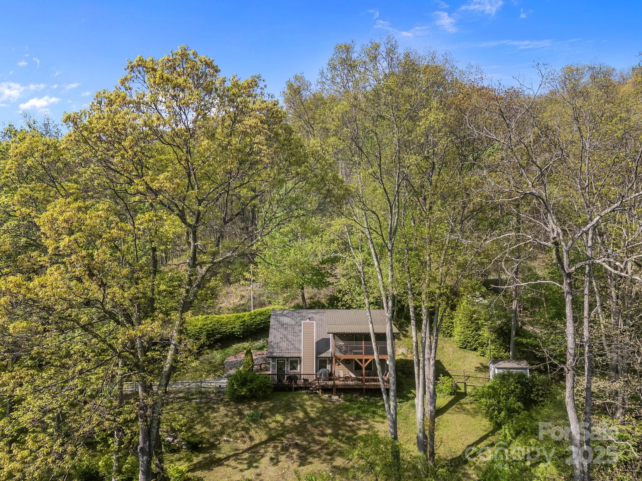 1954 Utah Mountain Road Waynesville, NC 28785 - Photo 8 of 39 a view of a house with a mountain in the background