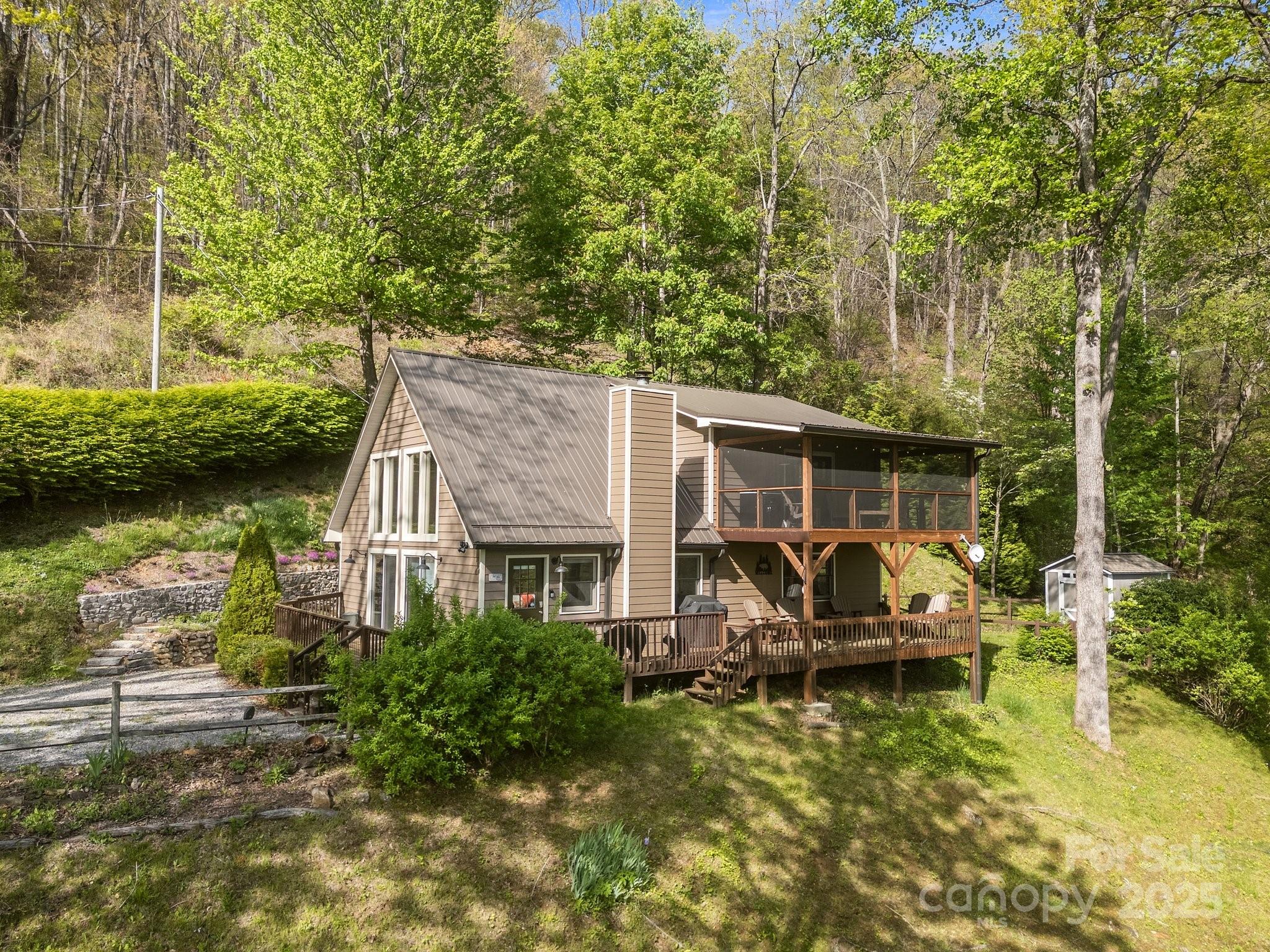 1954 Utah Mountain Road Waynesville, NC 28785 - Photo 9 of 39 a view of a house with swimming pool and sitting area