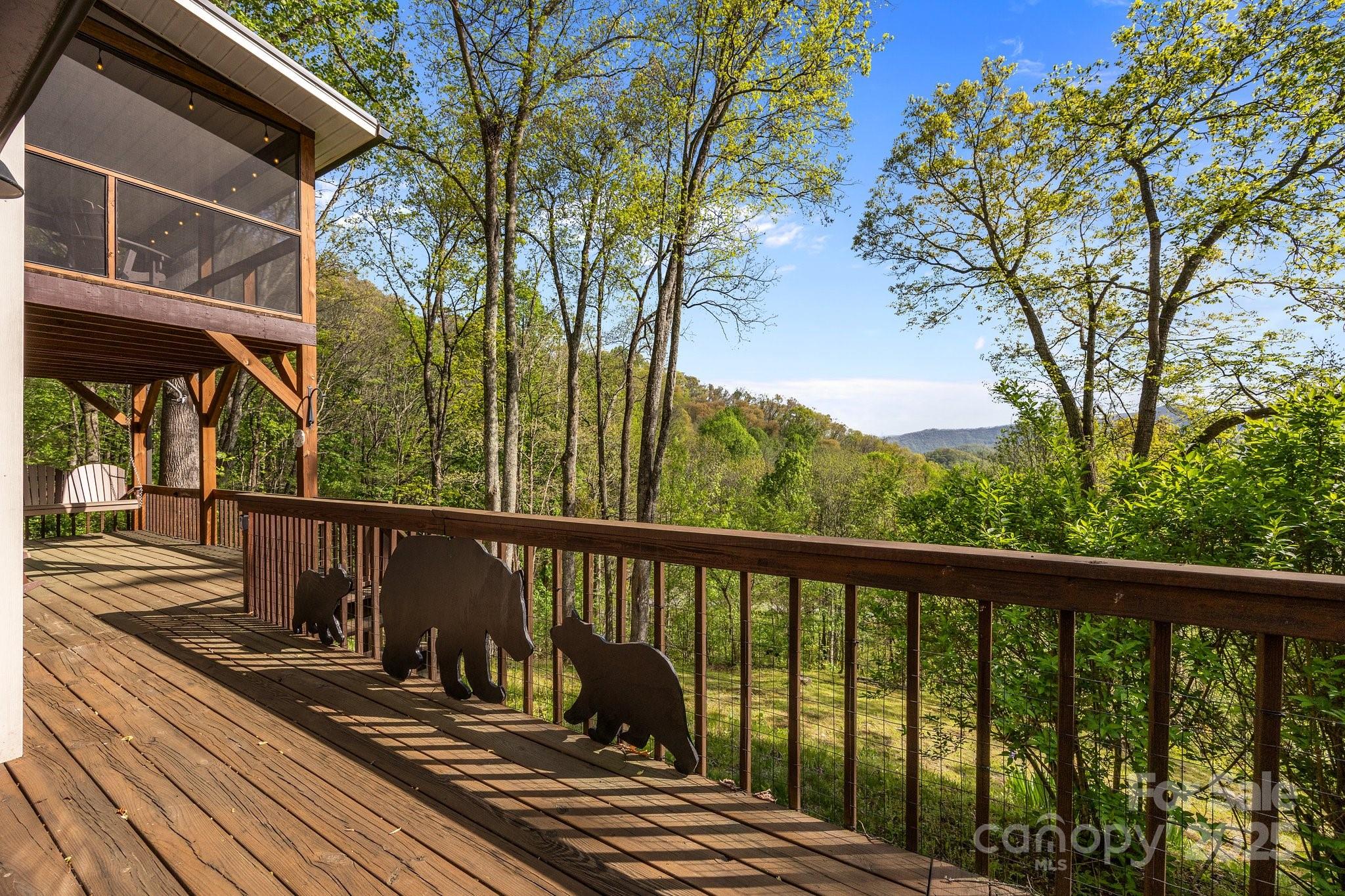 1954 Utah Mountain Road Waynesville, NC 28785 - Photo 10 of 39 a view of a balcony with wooden floor and fence