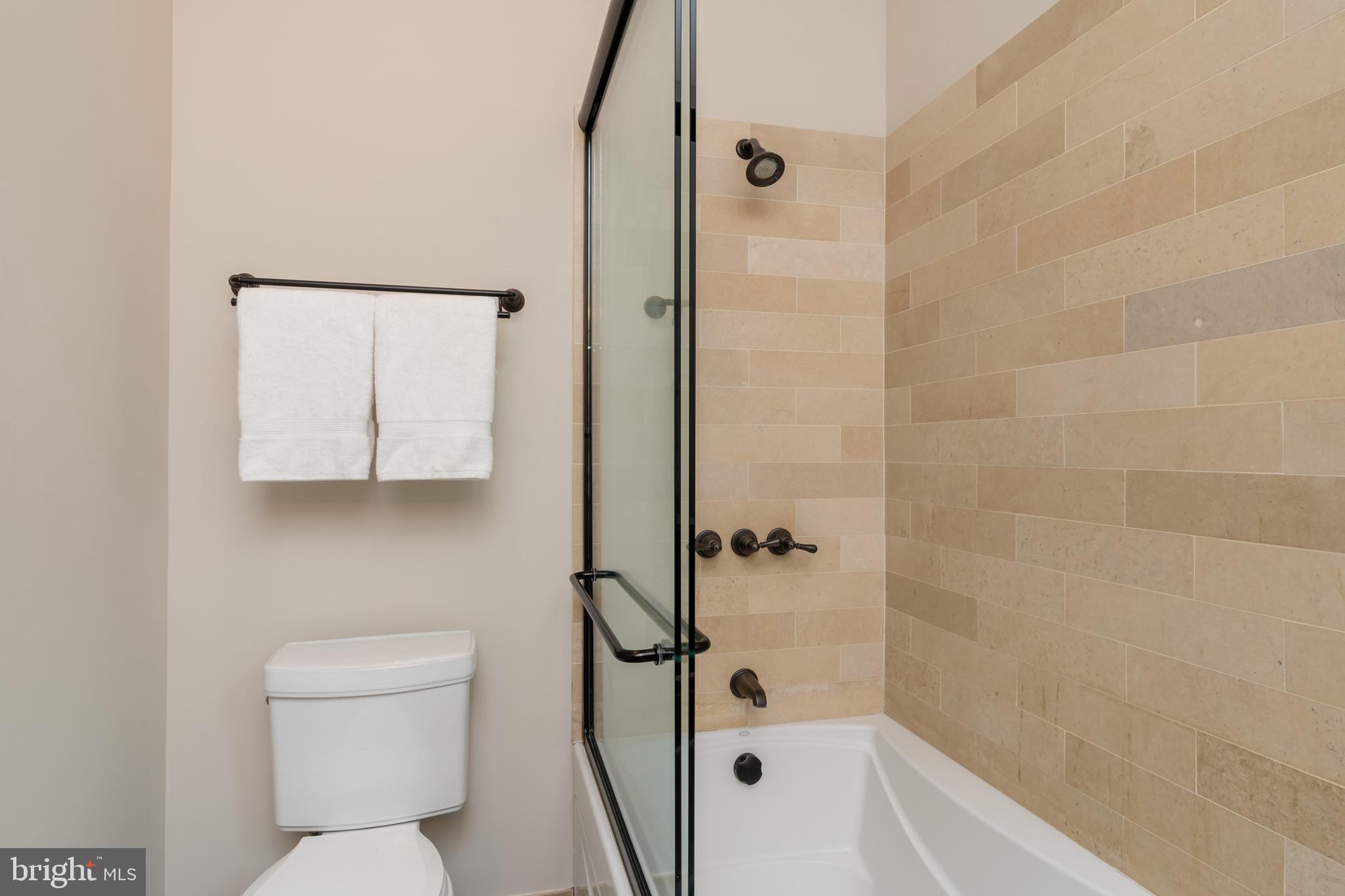 1451 Q Street Northwest Washington, DC 20009 - Photo 36 of 43 Limestone tub/shower enclosure