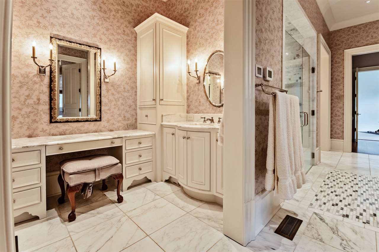 4275 Gwynne Road Memphis, TN 38117 - Photo 19 of 25 There are two vanities, two lavatory closets, two closets, shower with wider doors for wheel chair accessibility, soaking tub. Master also has a packing closet & workout room.