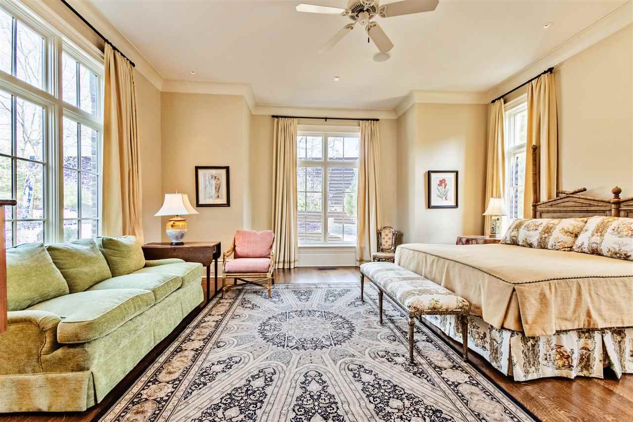 4275 Gwynne Road Memphis, TN 38117 - Photo 22 of 25 There are two very spacious bedrooms down in this home each with their own private bathroom. Double vanities in both baths. The bedrooms have their own hallway with a reading area. Two more bedrooms upstairs with their own bath.