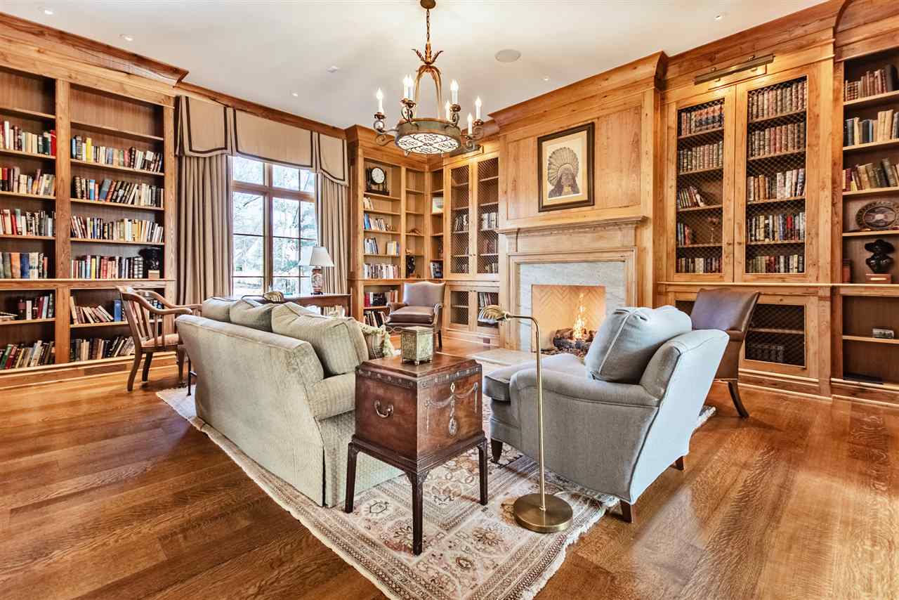 4275 Gwynne Road Memphis, TN 38117 - Photo 5 of 25 Upon entering you find exquisite details like the reclaimed wormy chestnut of this spacious study. Custom designed ladder to access shelves. Gas Oversized Fireplace