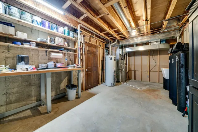 a view of a roof deck with table and chairs and wooden floor