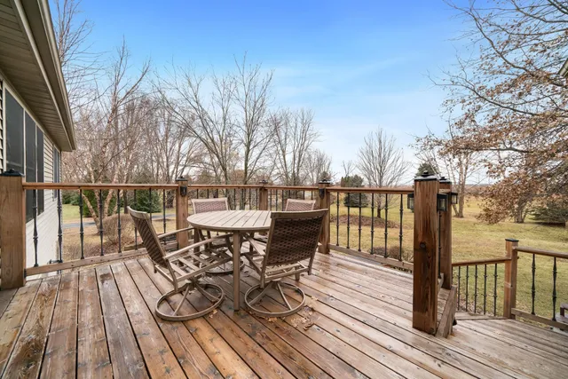 a view of a patio with a table and chairs