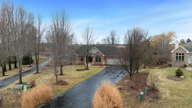a terrace with outdoor seating and lake view