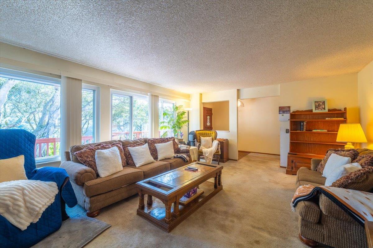 18117 Berta Canyon Road Salinas, CA 93907 - Photo 17 of 56 a living room with furniture and a large window
