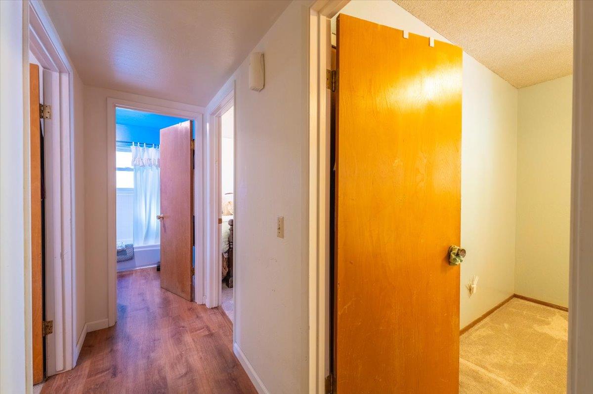 18117 Berta Canyon Road Salinas, CA 93907 - Photo 25 of 56 a view of a bathroom from a hallway
