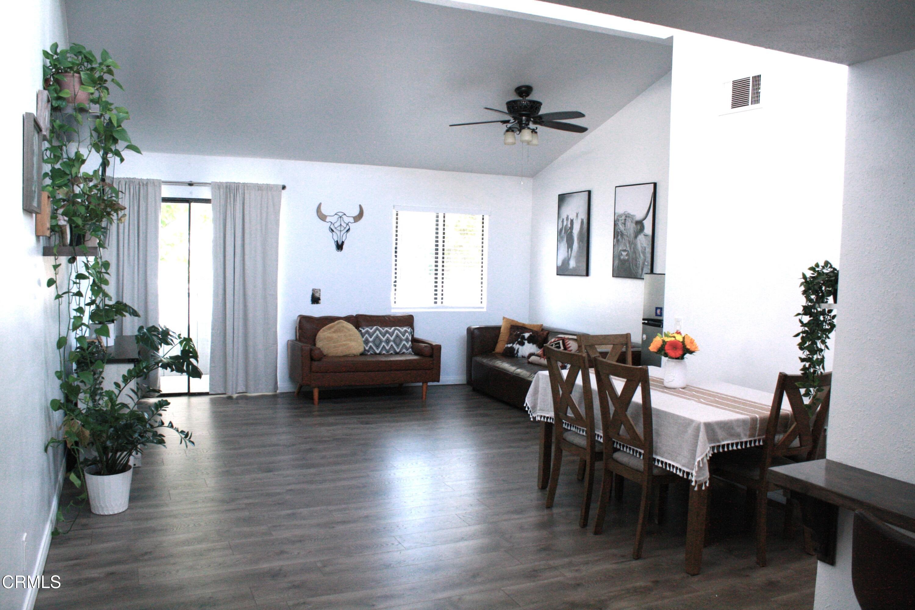 5246 Longfellow Way Oxnard, CA 93033 - Photo 2 of 15 a living room with furniture and wooden floor