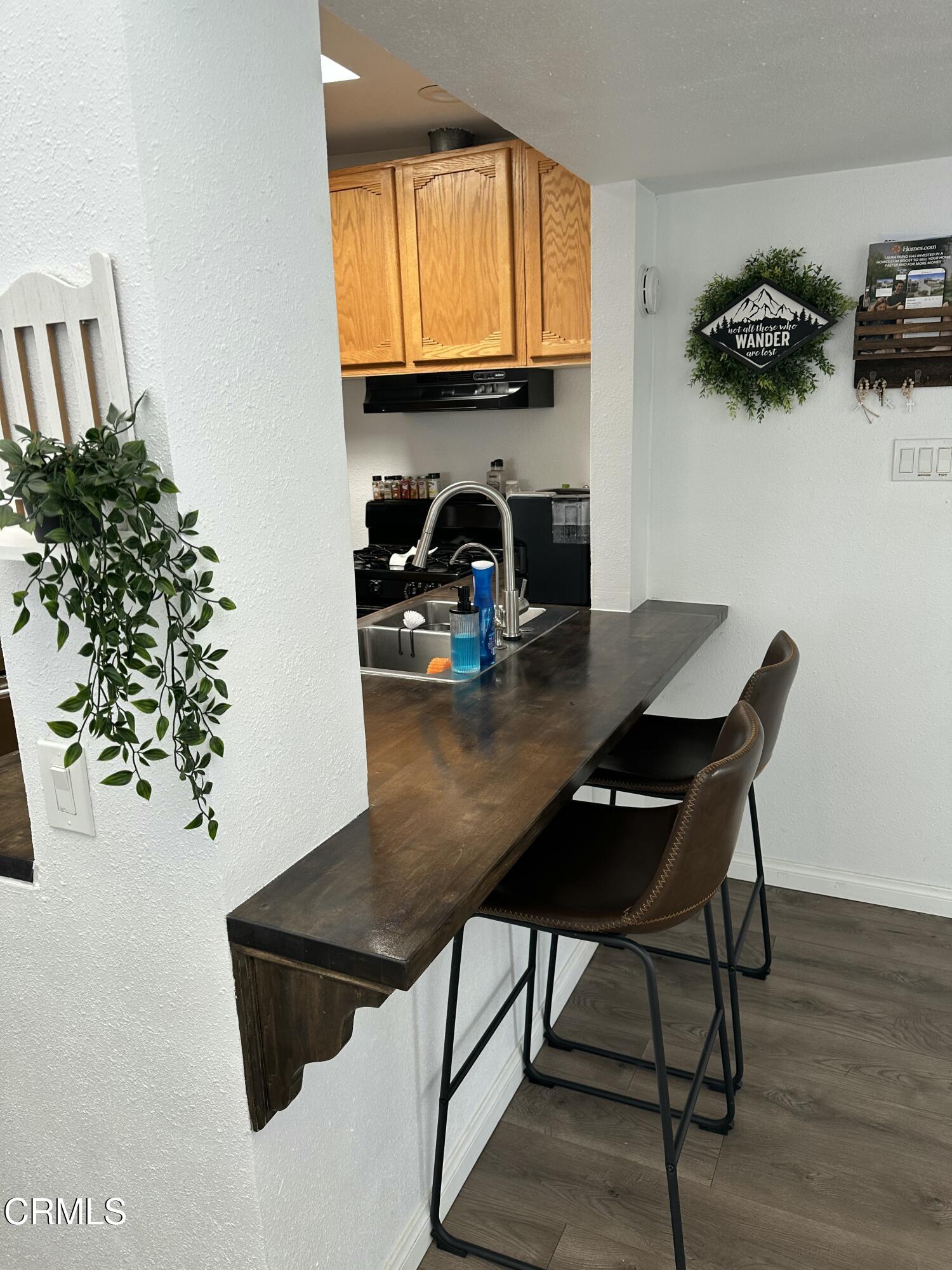 5246 Longfellow Way Oxnard, CA 93033 - Photo 6 of 15 a view of a kitchen with a table and a chair