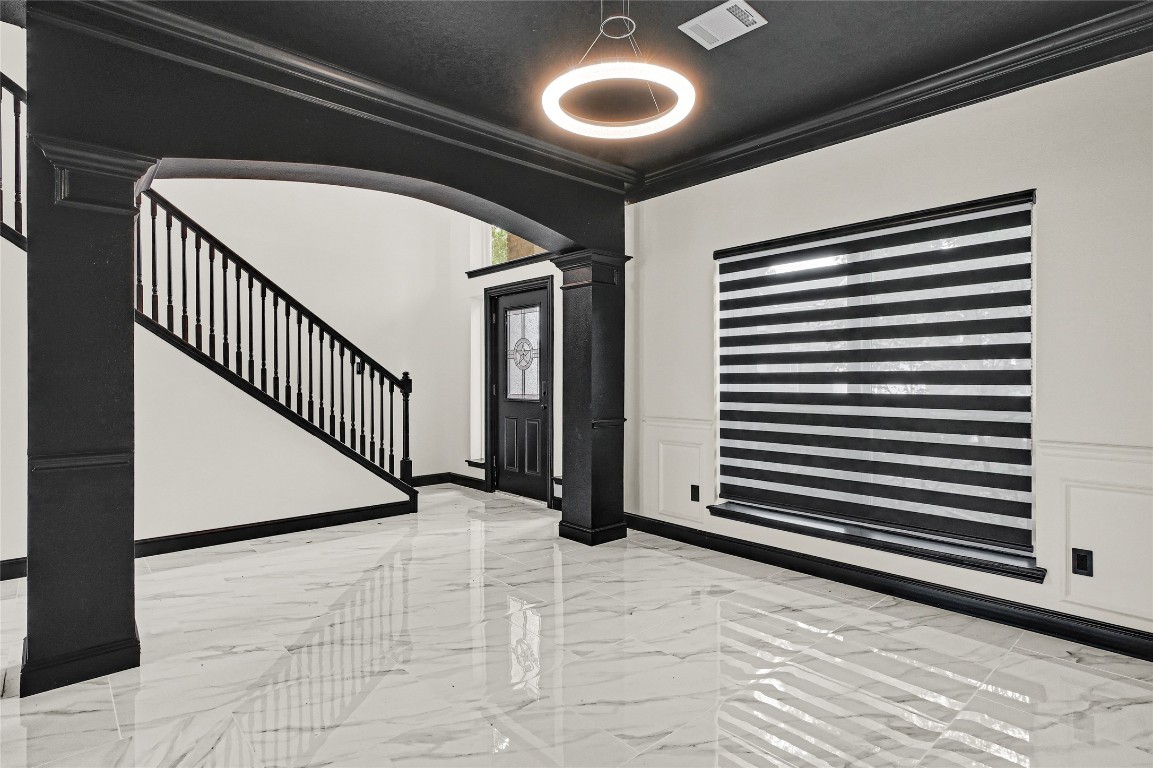 11915 Helene Court Pinehurst, TX 77362 - Photo 14 of 33 a view of a hallway with stairs and a window