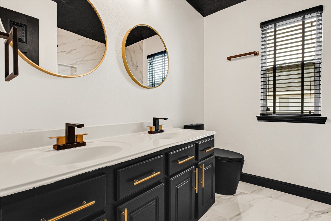 11915 Helene Court Pinehurst, TX 77362 - Photo 18 of 33 a bathroom with a sink and a mirror