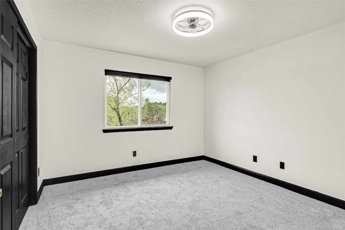 11915 Helene Court Pinehurst, TX 77362 - Photo 19 of 33 an empty room with windows