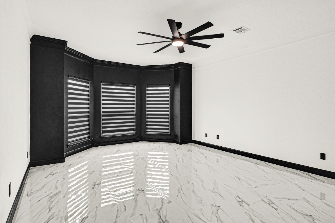 11915 Helene Court Pinehurst, TX 77362 - Photo 28 of 33 a view of an empty room with a ceiling fan
