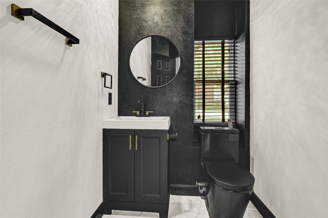 11915 Helene Court Pinehurst, TX 77362 - Photo 29 of 33 a bathroom with a sink and a mirror
