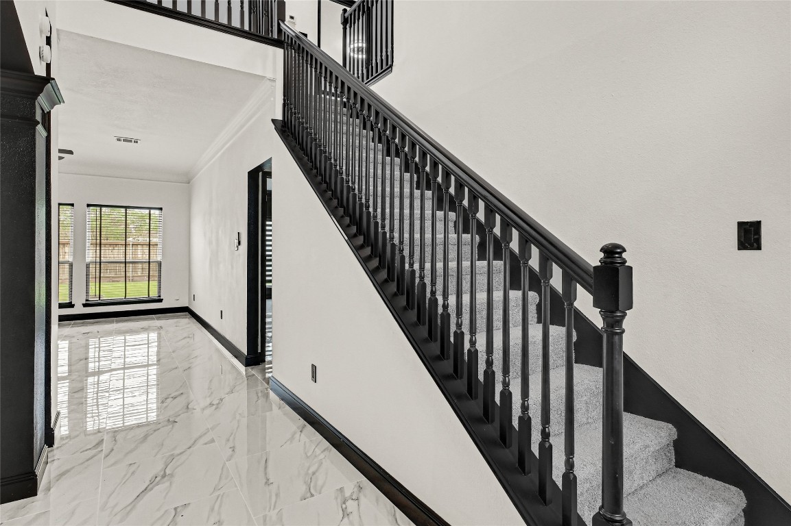 11915 Helene Court Pinehurst, TX 77362 - Photo 31 of 33 a view of staircase with wooden floor and white walls