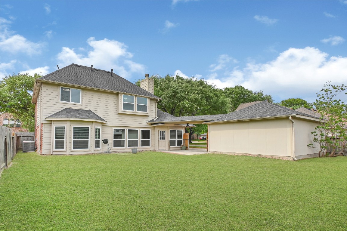 11915 Helene Court Pinehurst, TX 77362 - Photo 32 of 33 a house view with a garden space