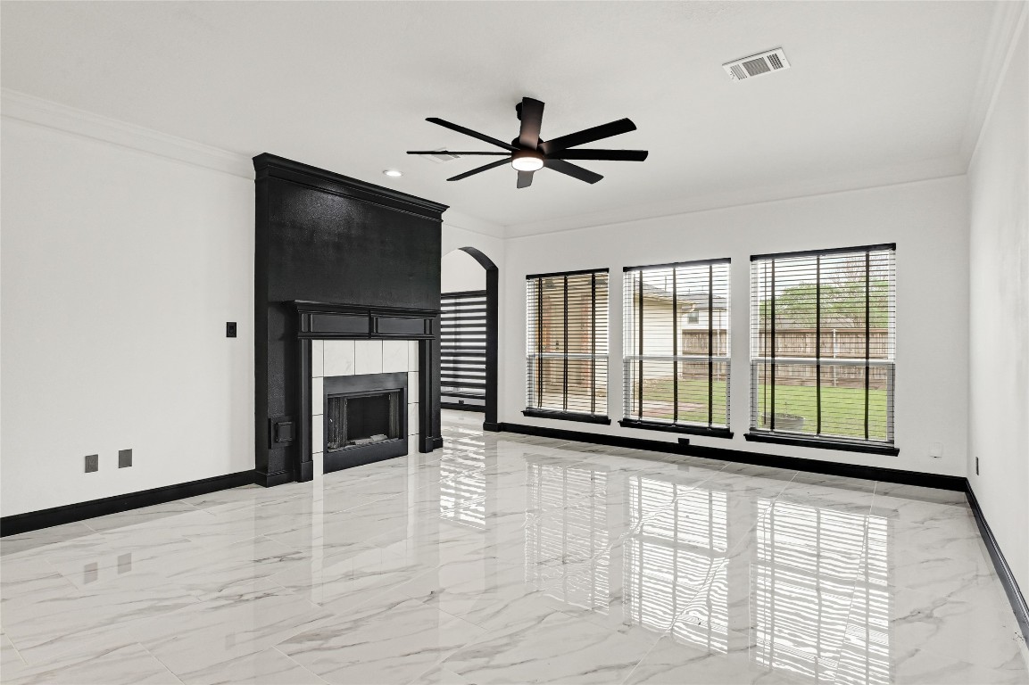 11915 Helene Court Pinehurst, TX 77362 - Photo 10 of 33 a view of an empty room with a fireplace and a window