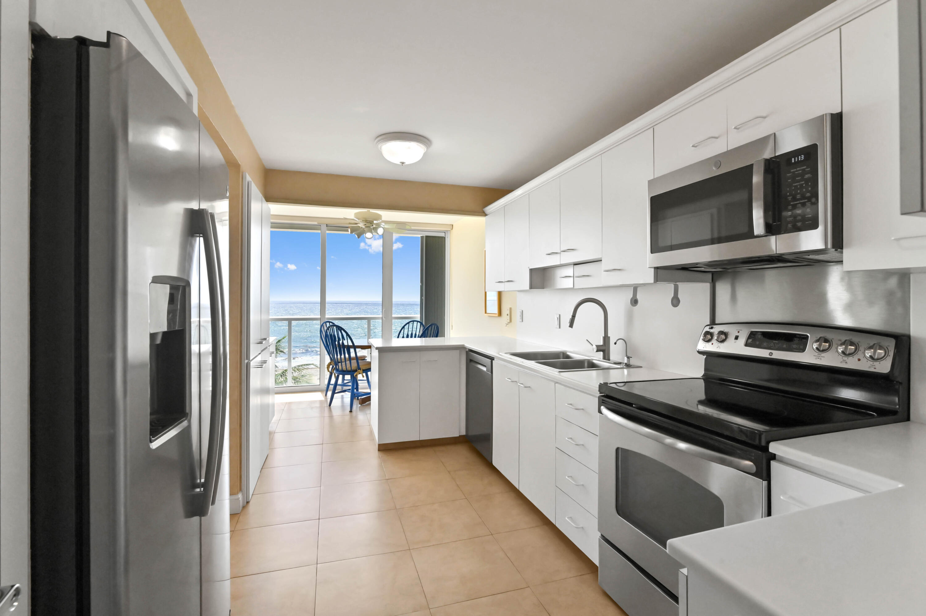 2800 South Ocean Boulevard, Unit 5J Boca Raton, FL 33432 - Photo 8 of 56 a kitchen with stainless steel appliances granite countertop a stove and a sink