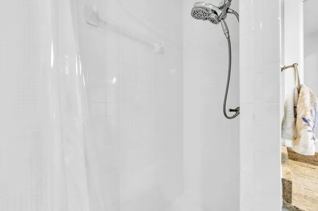 a view of a house with backyard and trees