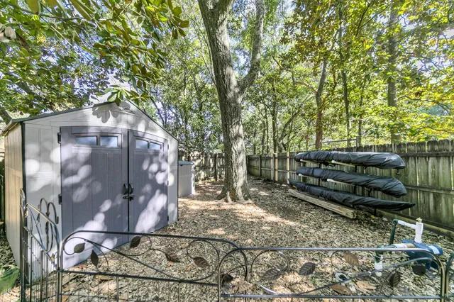 a view of a house with a large trees