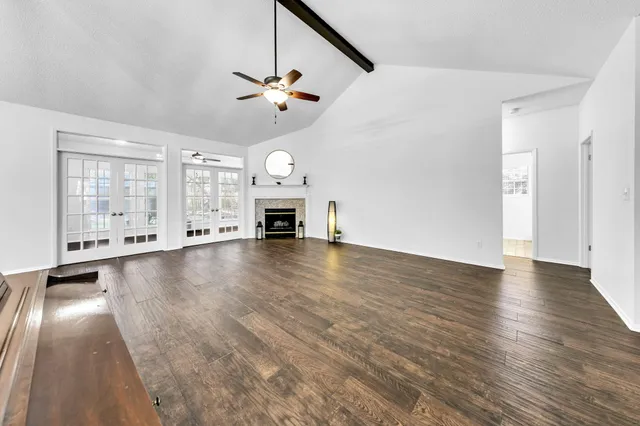 a living room with a bed furniture and a window