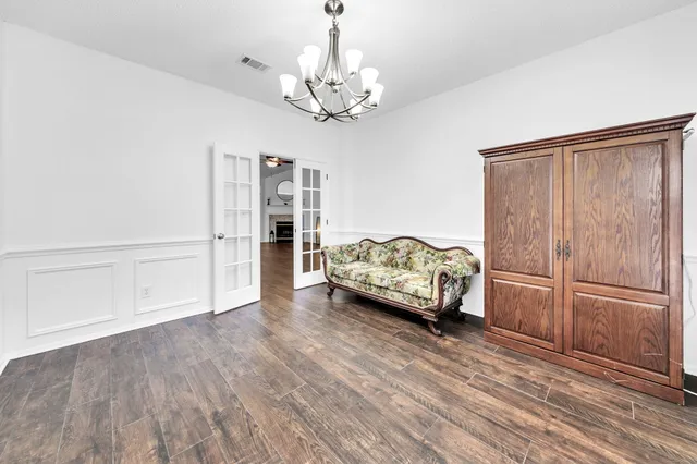 a view of livingroom with hardwood floor and ceiling fan