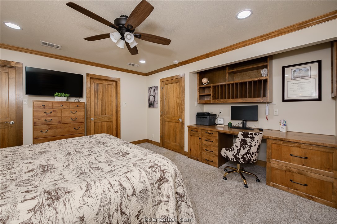 2302 Quail Run College Station, TX 77845 - Photo 14 of 49 a bedroom with a bed and a television