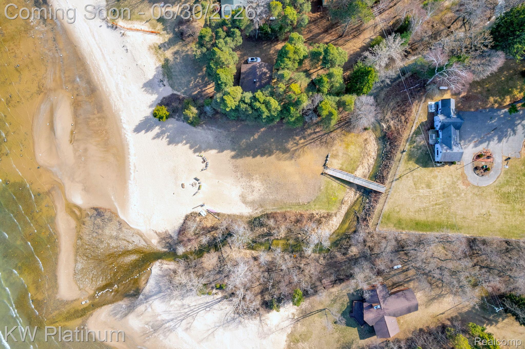2235 South Lake Shore Road Harbor Beach, MI 48441 - Photo 86 of 99 Aerial perspective showcasing a sandy shoreline with a private dock