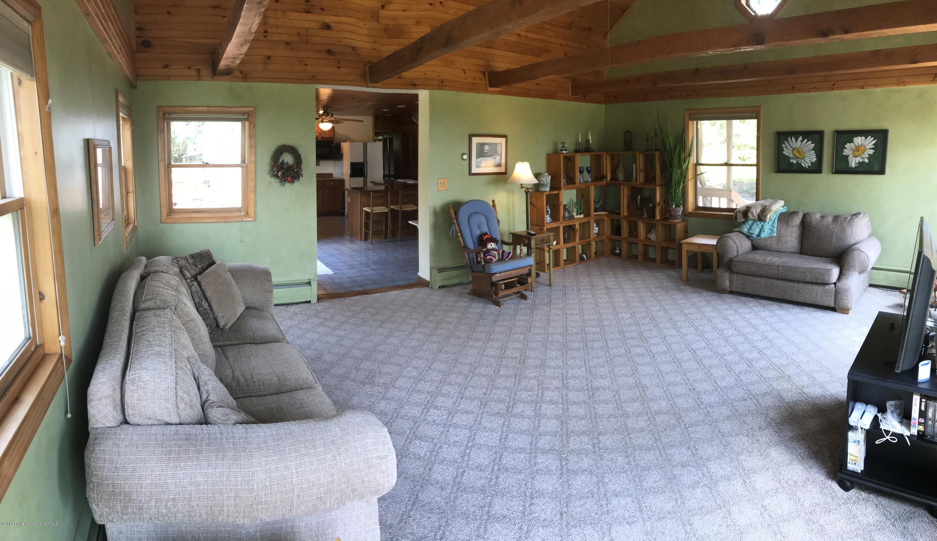 16 Lesher Road Tunkhannock, PA 18657 - Photo 9 of 47 a living room with furniture and a wooden floor