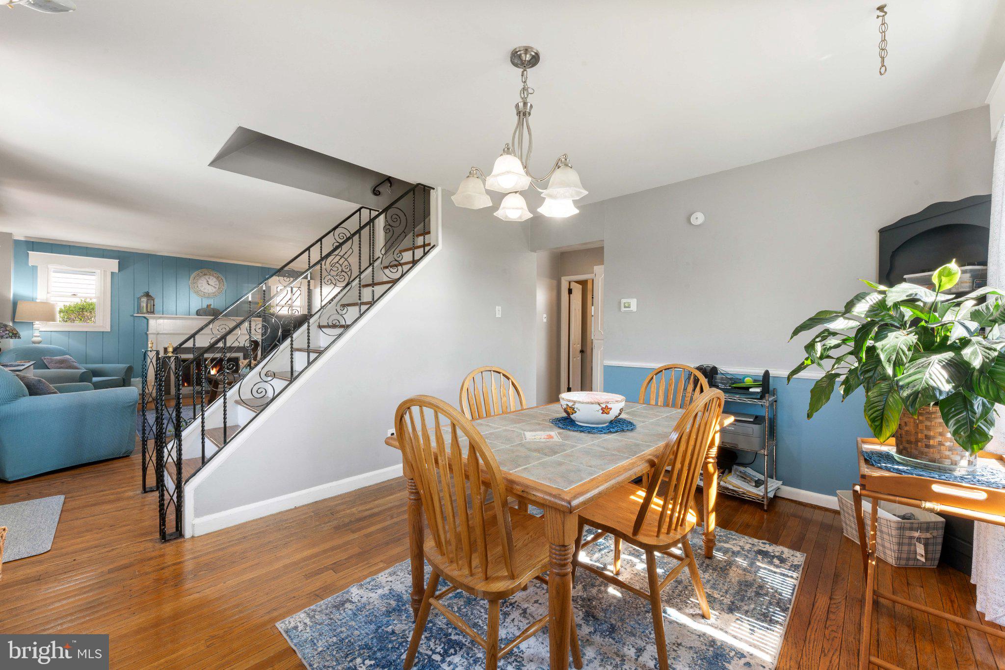 329 Ashland Avenue Secane, PA 19018 - Photo 14 of 33 a dining room with furniture potted plants and wooden floor