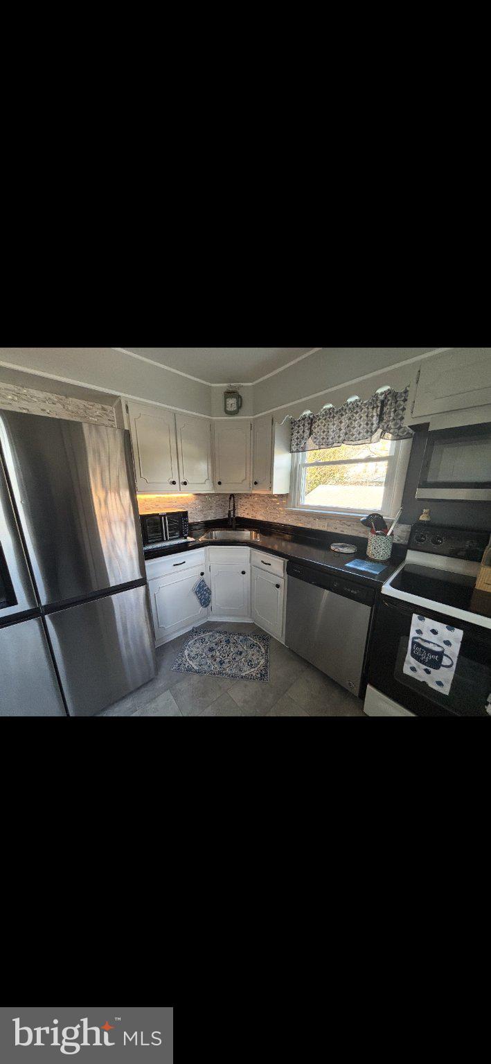329 Ashland Avenue Secane, PA 19018 - Photo 21 of 33 a view of kitchen island with stainless steel appliances