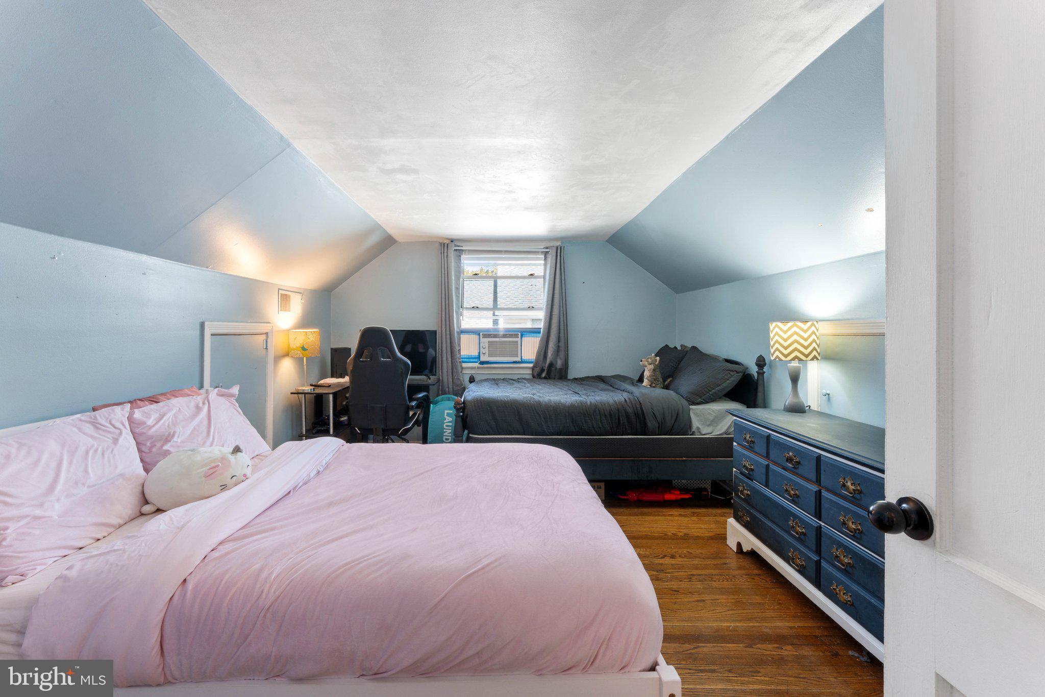 329 Ashland Avenue Secane, PA 19018 - Photo 25 of 33 a large bedroom with a bed and wooden floor