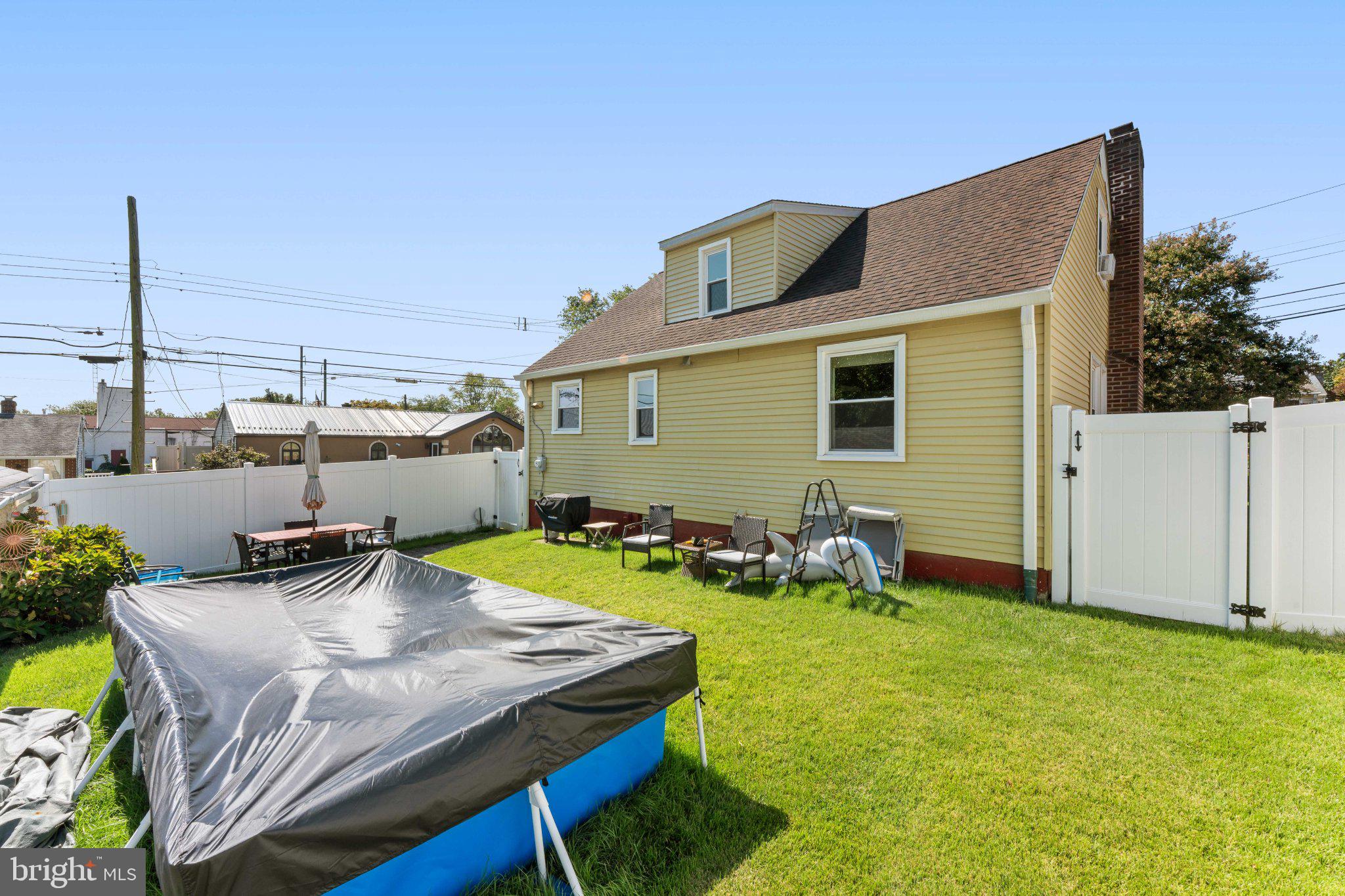 329 Ashland Avenue Secane, PA 19018 - Photo 5 of 33 a view of a backyard with table and chairs and potted plants